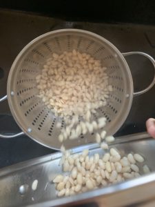 draining the beans after the soak.