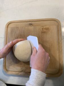 Second movement in preshaping the loaves