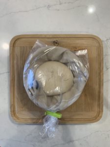 Sealing the round boule banneton in a bag for refrigerator storage