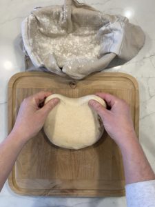 The first step of shaping an oval boule