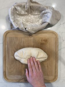 The third step of shaping an oval boule