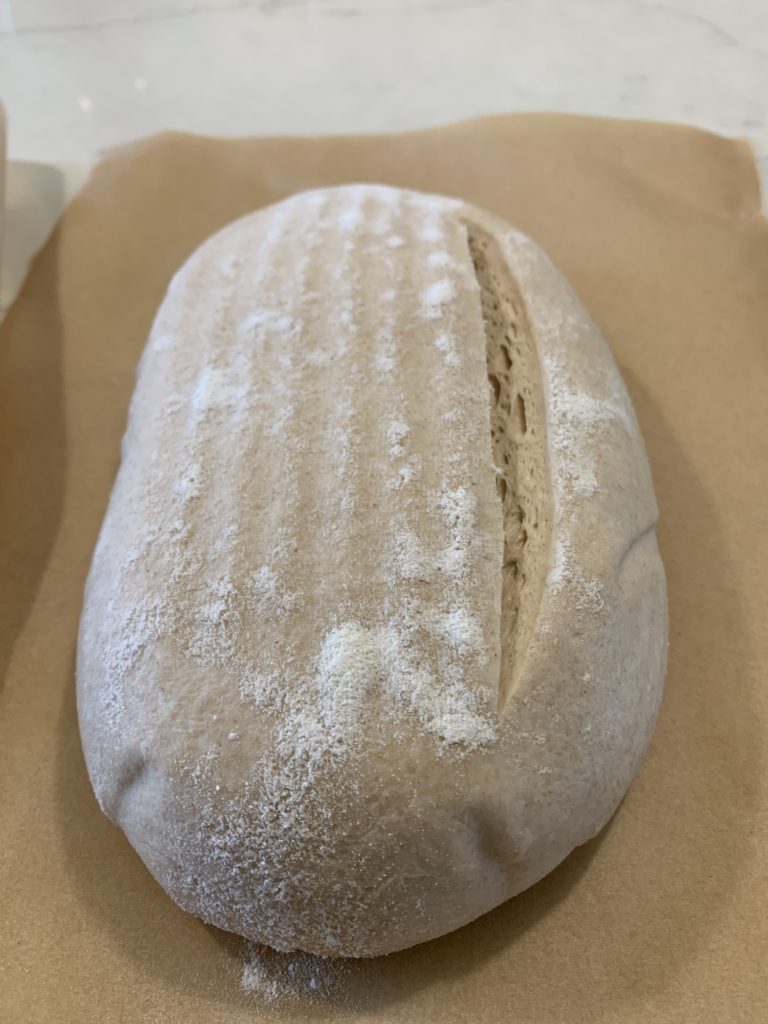 A view of the oval loaf to show how deep the score is