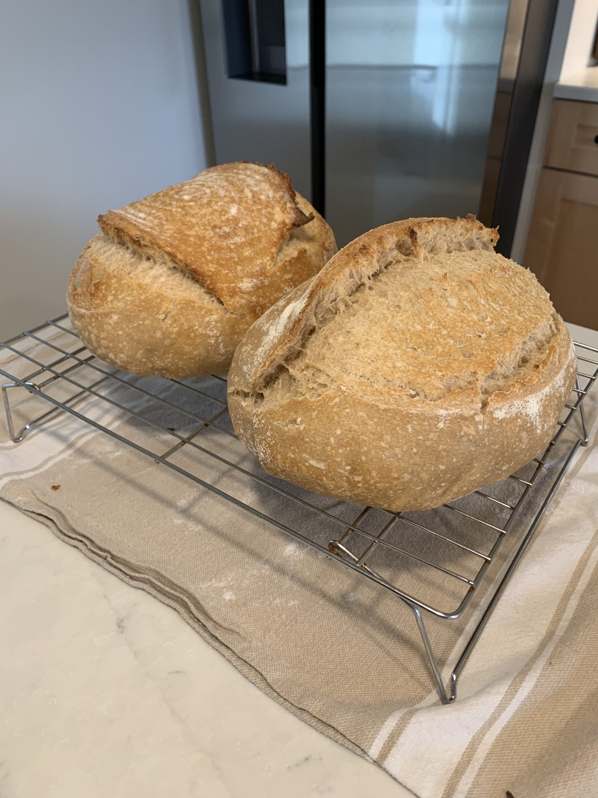 Finished sourdough cooling on a rack